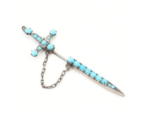 An early 20th century continental 900 silver and turquoise set sword and scabbard jabot pin. Marked '900' for silver. Weight: