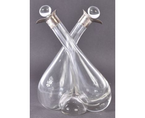 An Edwardian hallmarked silver collared glass double oil and vinegar decanter. Complete with both original stoppers. Hallmark