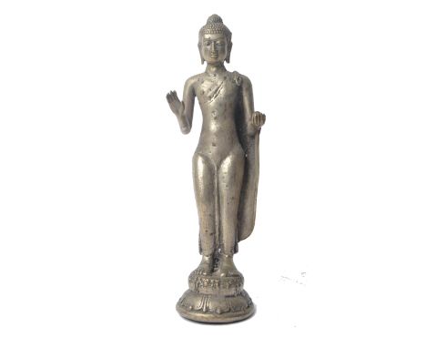 A 20th century Hindu Indian bronzed figural statue of Buddha. Buddha depicted standing with hands in the abhaya mudra holding