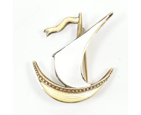 A Scandinavian sterling silver and guilloche enamel brooch pin. The brooch in the form of a sailing boat with applied yellow 