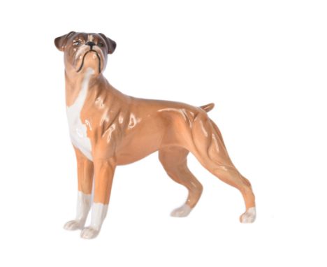 A vintage Beswick made ceramic boxer dog. Depicted standing on all-fours, with head raised. Maker's marks to foot. Undamaged.