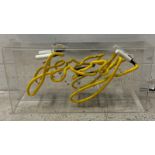 A novelty yellow neon sign "Foxy"