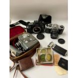 A small selection of 35mm cameras to include a Pentax, Canon and a cine camera.