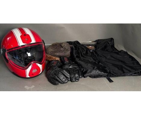 A selection of motorcycle clothing to include a Harley Davidson zip vest, Dynamic gloves and a Carberg helmet small 55-56 