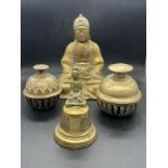 A Buddha and three bells, two elephants claw bells and one other