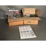 Two boxed 24hr M.O.D ration packs with sealed meals and snacks