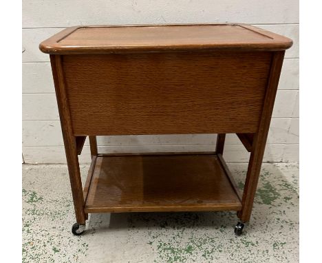 A Mid Century teak work box on castors with shelf under H62cm W62cm D44cm)