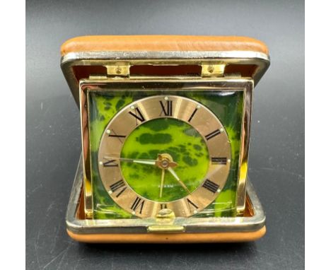 A Coral, made in Japan traveling alarm clock.