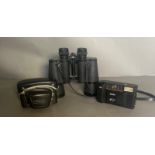A pair of Hans Weiss field glasses along with a Halina camera and a pacer camera.