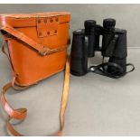 A pair of cased green field binoculars