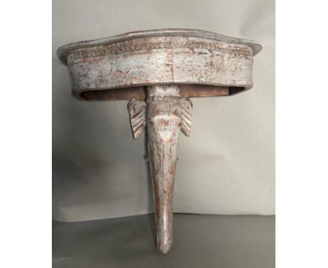 A wooden grey painted wall hanging shelf in the form of an elephant H46cm 