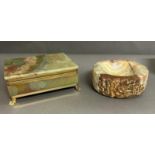 An onyx cigarette box on brass lion paw feet and an onyx ash tray