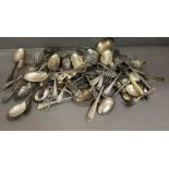 A quantity of silver plate and white metal flatware to include spoons, forks and a ladel