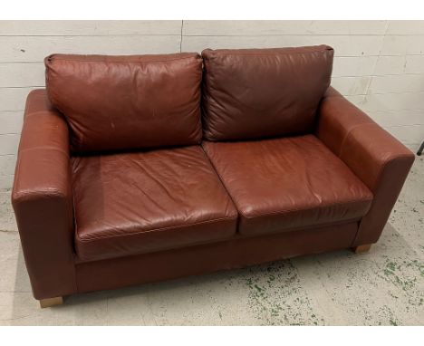 Two seater leather sofa bed (H73cm W166cm D86cm)