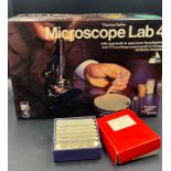 A Thomas Salter Microscope Lab $ along with several boxes of slides, including prepared slides of