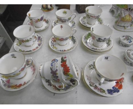 DECORATIVE ROYAL DOULTON TEA CUPS AND SAUCERS