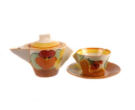 A Clarice Cliff for Newport Pottery tété à tété, from the Bizarre range and in the high Art Deco form, in the pattern of Nast