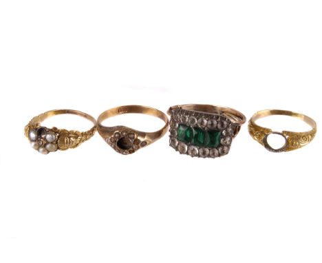 A group of four antique gold ring, each damaged, including one with green and clear dress ring, one having engraved shoulders