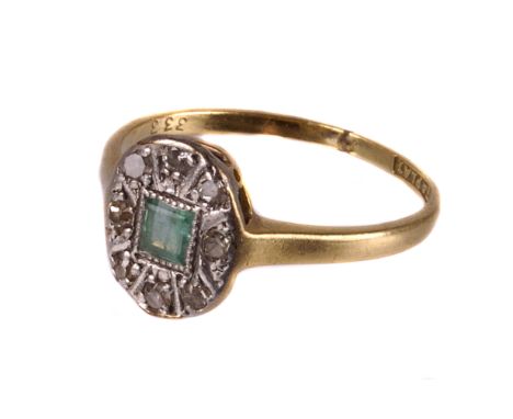 An Art Deco emerald and diamond ring, the platinum shaped tablet centred with a square cut light green stone having several s