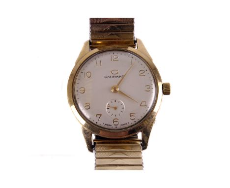 A 1960s Garrard gentleman’s 9ct gold dress watch, the silvered dial with applied gold Arabic numerals, and subsidiary seconds