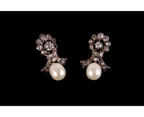 A pair of Victorian metamorphic diamond and pearl earrings, the tied bow mounts in white metal set with old cut stones having