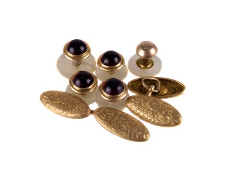 A pair of late Victorian 15ct gold cufflinks, the oblong panels with engraved designs, together with a set of four red cabuch