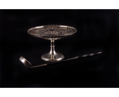 A George V reticulated silver tazza, London 1913 by Carrington & Co., plus a baleen handled punch ladle 12ozt. gross 