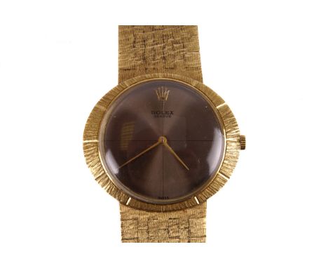 A 1960s 18ct Rolex Cellini gold dress watch, the oval case with signed brown metallic dial with gold tapered hands, 19 jewel 