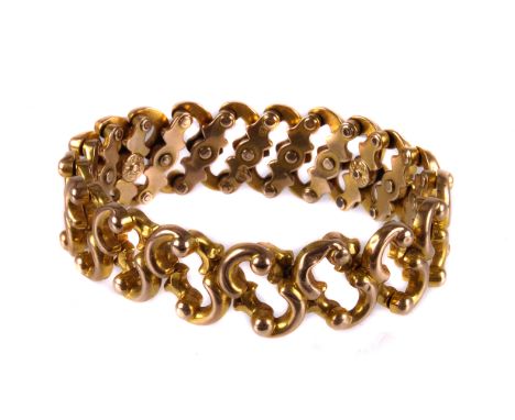 A good quality antique expanding 9ct gold bracelet, the C scroll links riveted to inner, marked Baden and Patent, approx 14.2