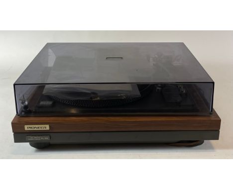 A late 1970s Pioneer record turntable, direct drive motor, model PL-55, with operating instructions and two cased replacement