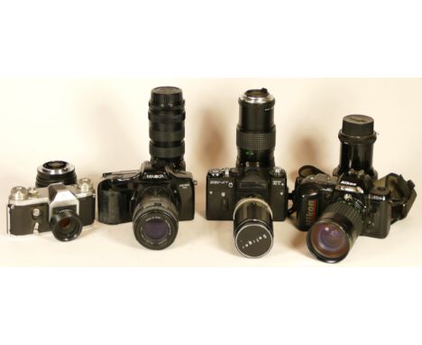 Four 35mm film cameras with lenses to include a Zenit ET with a Soligor 200mm f4.5 lens, a Nikon N4004s with a Hanimex 28mm-2