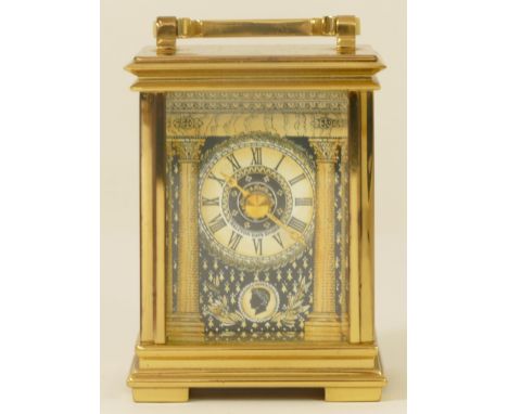 A boxed limited edition Halcyon Days enamel and brass cased limited edition mantle clock, 10cm high, complete with certificat