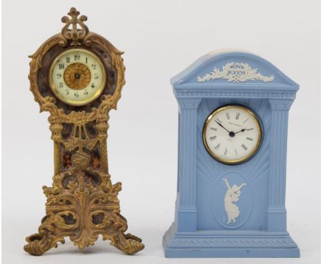 A 20th century blue and white Wedgewood Jasperware cased quartz mantle clock, 20cm high together with an Art Nouveau brass mo