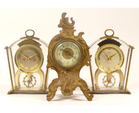 A 20th century German gilt metal cased cartouche shaped mantle clock, 17cm high, together with two 20th century Schatz 8 day 