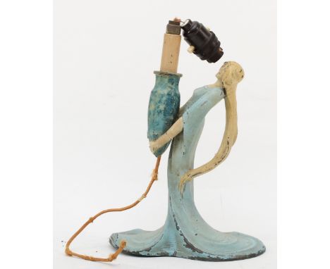 A 20th century cold painted pewter figural table lamp, cast in the form a lady holding a vase, 24cm high