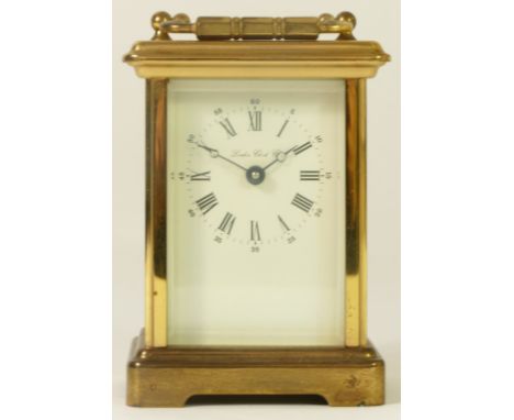London Clock Co., a brass carriage time piece with white enamel dial, key, 12cm high 