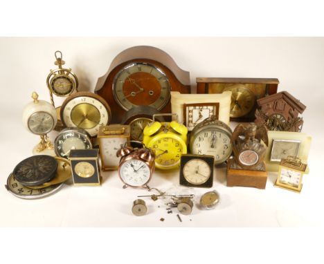 A collection of mid 20th century and later mantel clocks, having manual wind and quartz movements, in two boxes. (2) 