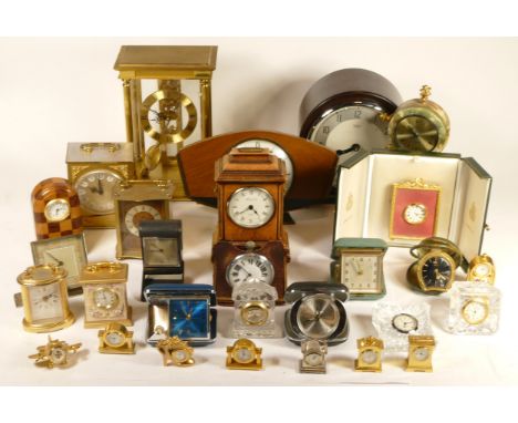 A collection of mid 20th century and later mantel clocks, having manual wind and quartz movements, in two boxes. (2) 