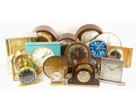 A collection of mid 20th century and later mantel clocks, having manual wind and quartz movements, in two boxes. (2) 