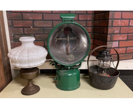 A Tilley FL6 paraffin-powered flood lamp, c.1940's, later green painted, together with an oil lamp and a brass jam pan. (3) 