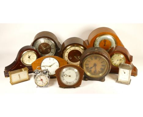 A collection of mid 20th century and later mantel clocks, having manual wind and quartz movements, in two boxes. (2) 