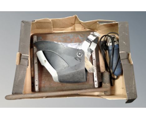 A welding mask, angle grinder and sheet metal guillotine 