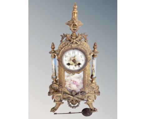 A French gilt metal and porcelain eight day mantel clock 