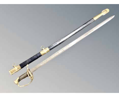 A reproduction cavalry sabre in scabbard together with antique fencing foil 