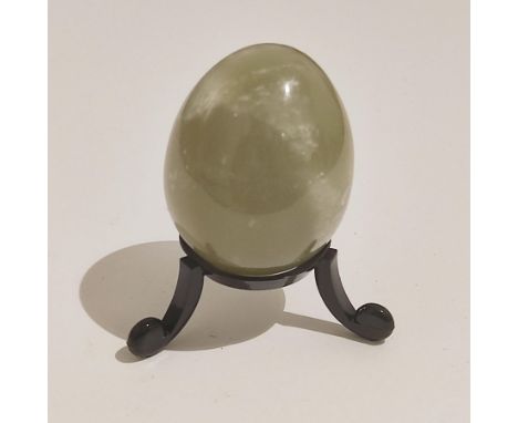 A Nephrite jade egg from Brazil, no stand included, and a Chalcedony stalacite crystal from Peru. 