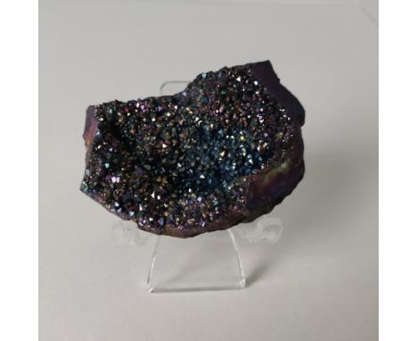A Titanium aura amethyst rainbow crystal from Namibia and a purple agate slice from Mexico. 