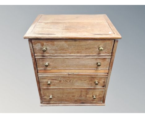 A 19th century oak commode chest width 61 cm together with an upholstered foot stool 