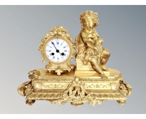 A French gilt bronzed figural eight day mantel clock 