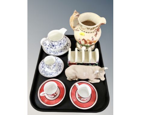 A Nao figure of a bull, Old Tupton Ware toast rack, Royal Doulton Sapphire Blossom milk jug, bowl, coffee can and saucer, two