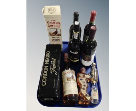 Nine various bottles of alcohol, Famous grouse Scotch, Porto Armilor ruby port, Chateau Martineau Bordeaux 1988 etc 